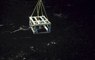 The Fish Spy rig is shown over the ocean.: Courtesy of Paula Dell/NSF/PolarTREC
